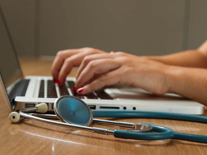 Doctor working on a laptop